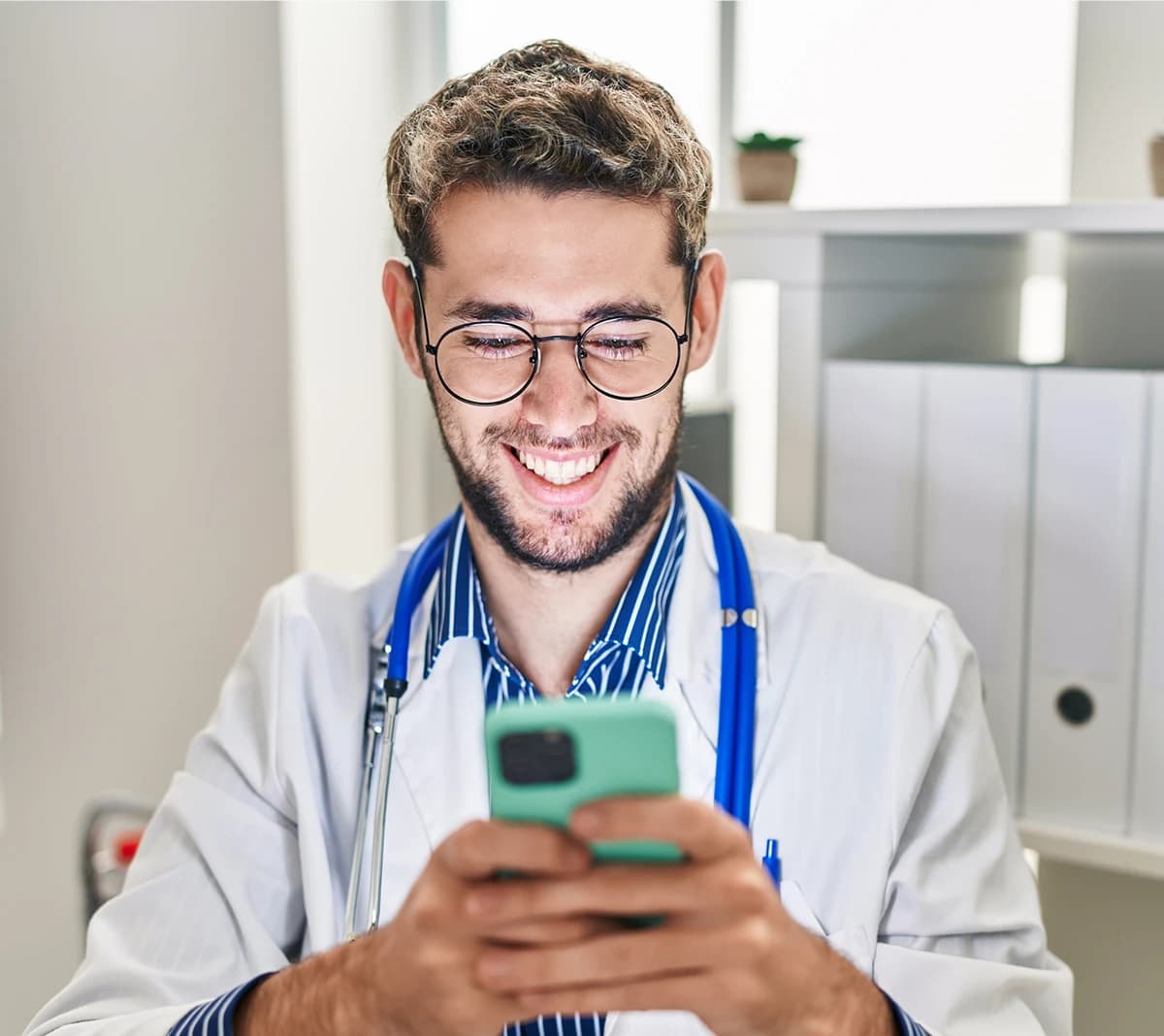 Healthcare professional using AsterMD on a phone